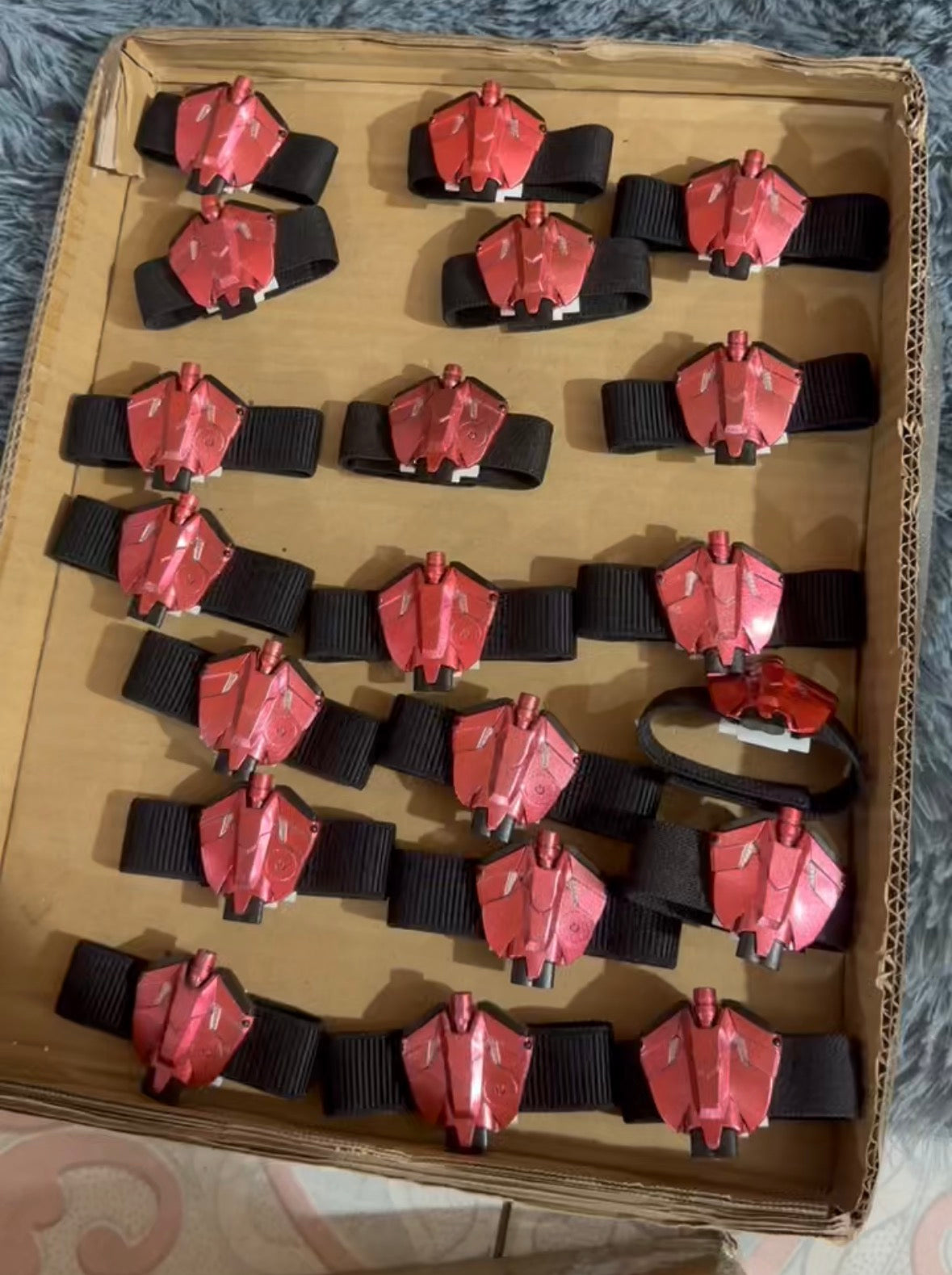 MaskOryx TASM2 Spider-Man wearable web shooter replica props in metallic red with black wrist straps in a display box